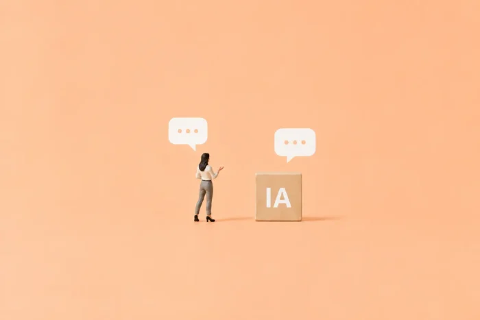 Illustration d'un personnage et d'un cube en bois illustrant l'intelligence artificielle dans un dialogue relevant d'un processus de recrutement.